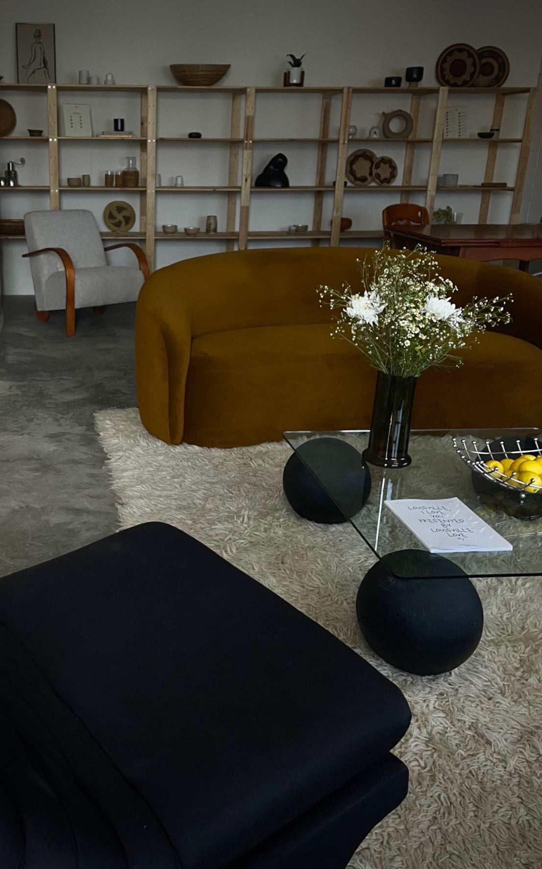 curved ochre sofa
