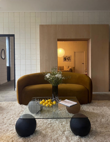 curved ochre sofa